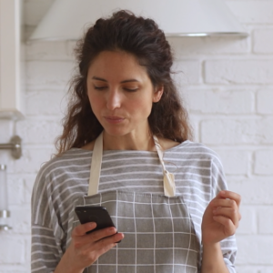in-kitchen-looking-at-phone