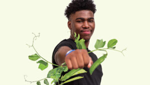 男人拿着植物来说明强度从植物蛋白质